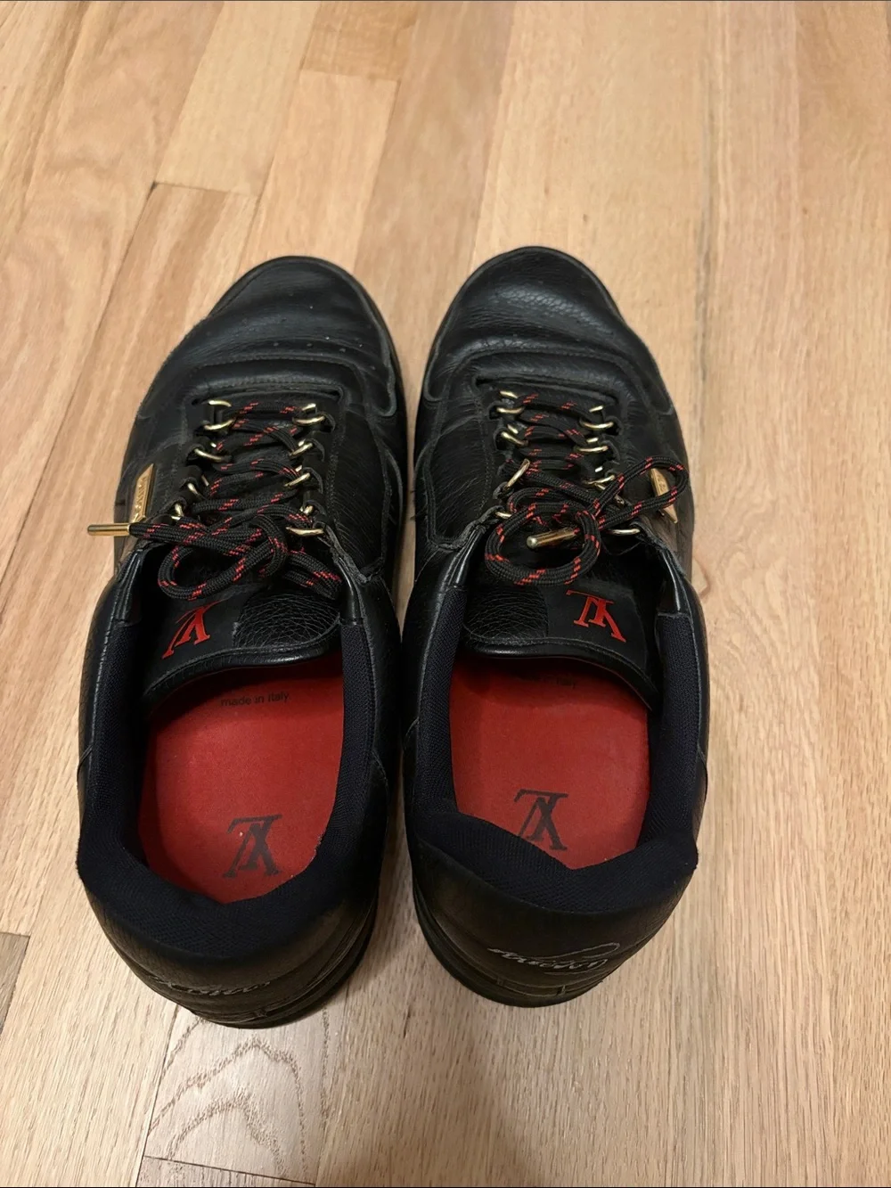 Louis Vuitton Black Leather Men's Sneakers with Red Insoles and Gold Accents